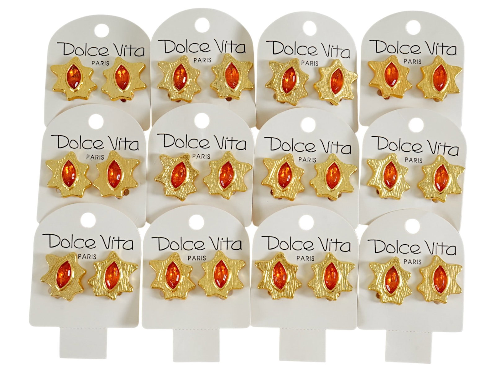 LOT OF 12 FRENCH DOLCE VITA COSTUME JEWELRY CLIP EARRINGS: A collection of twelve pairs of vintage French Dolce Vita Paris costume jewelry clip earrings. Presumably made in the 1980s. The gold tone earrings are made in an abstract design and encrusted with an