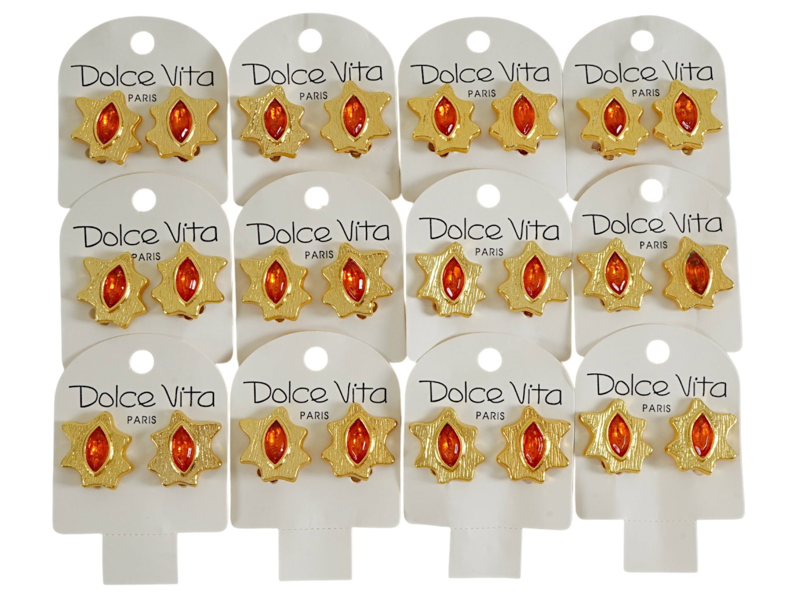 LOT OF 12 FRENCH DOLCE VITA COSTUME JEWELRY CLIP EARRINGS: A collection of twelve pairs of vintage French Dolce Vita Paris costume jewelry clip earrings. Presumably made in the 1980s. The gold tone earrings are made in an abstract design and encrusted with an