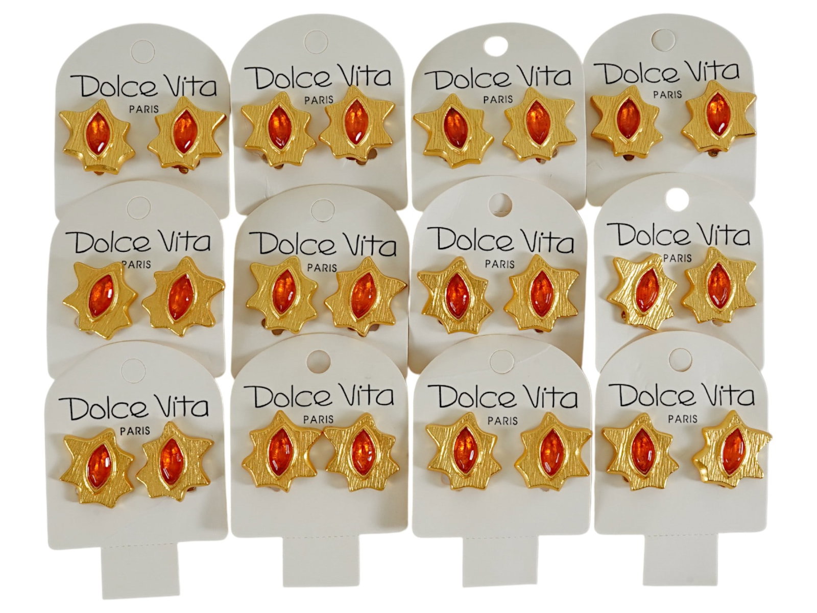 LOT OF 12 FRENCH DOLCE VITA COSTUME JEWELRY CLIP EARRINGS: A collection of twelve pairs of vintage French Dolce Vita Paris costume jewelry clip earrings. Presumably made in the 1980s. The gold tone earrings are made in an abstract design and encrusted with an