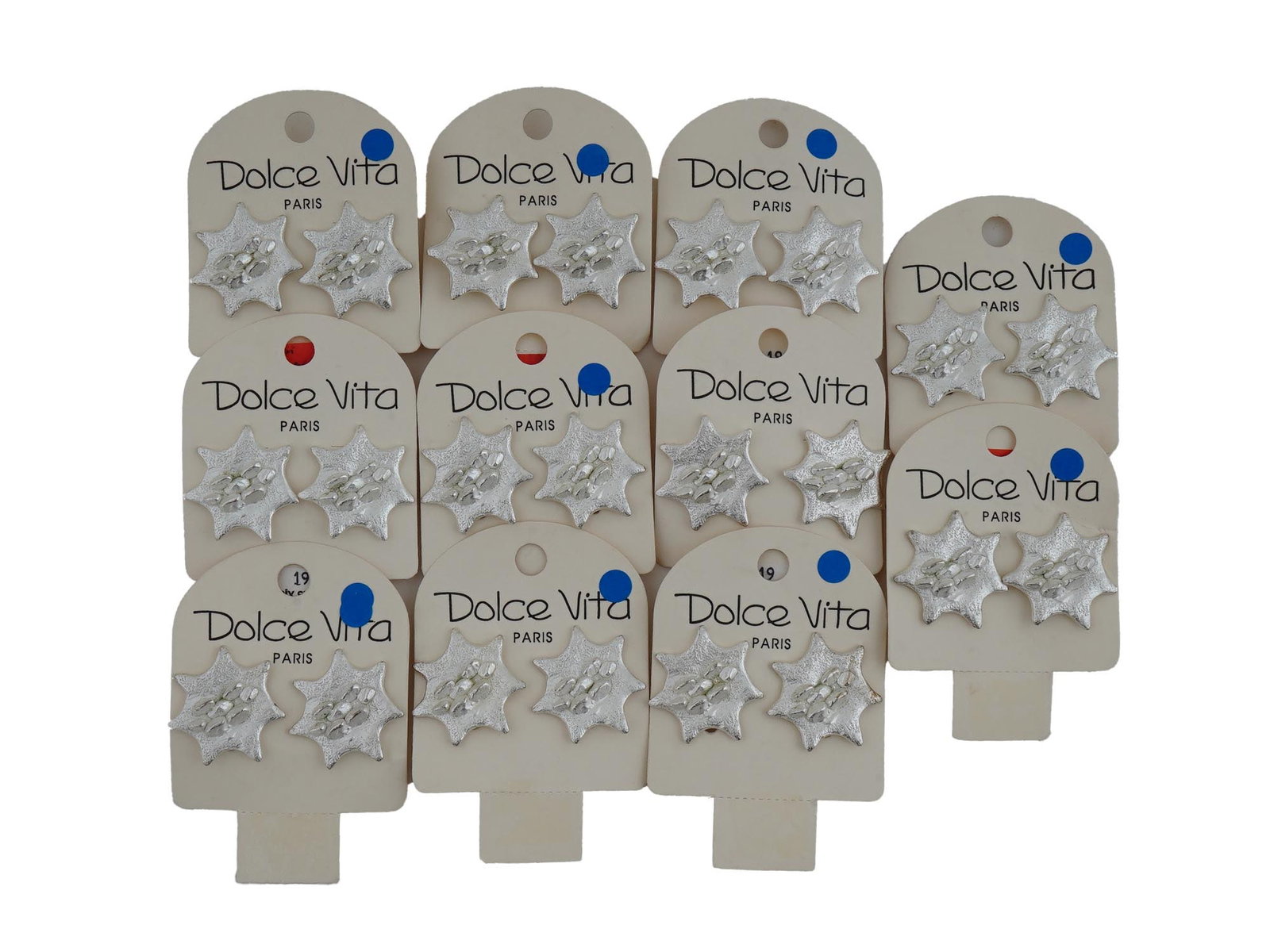 LOT OF FRENCH DOLCE VITA STAR CLIP ON EARRINGS: A lot of vintage French Dolce Vita costume jewelry, a total of 11 pairs of clip on earrings. Ca. 1980s. The items are designed in the shape of silver tone abstract stars. Original display cards with t