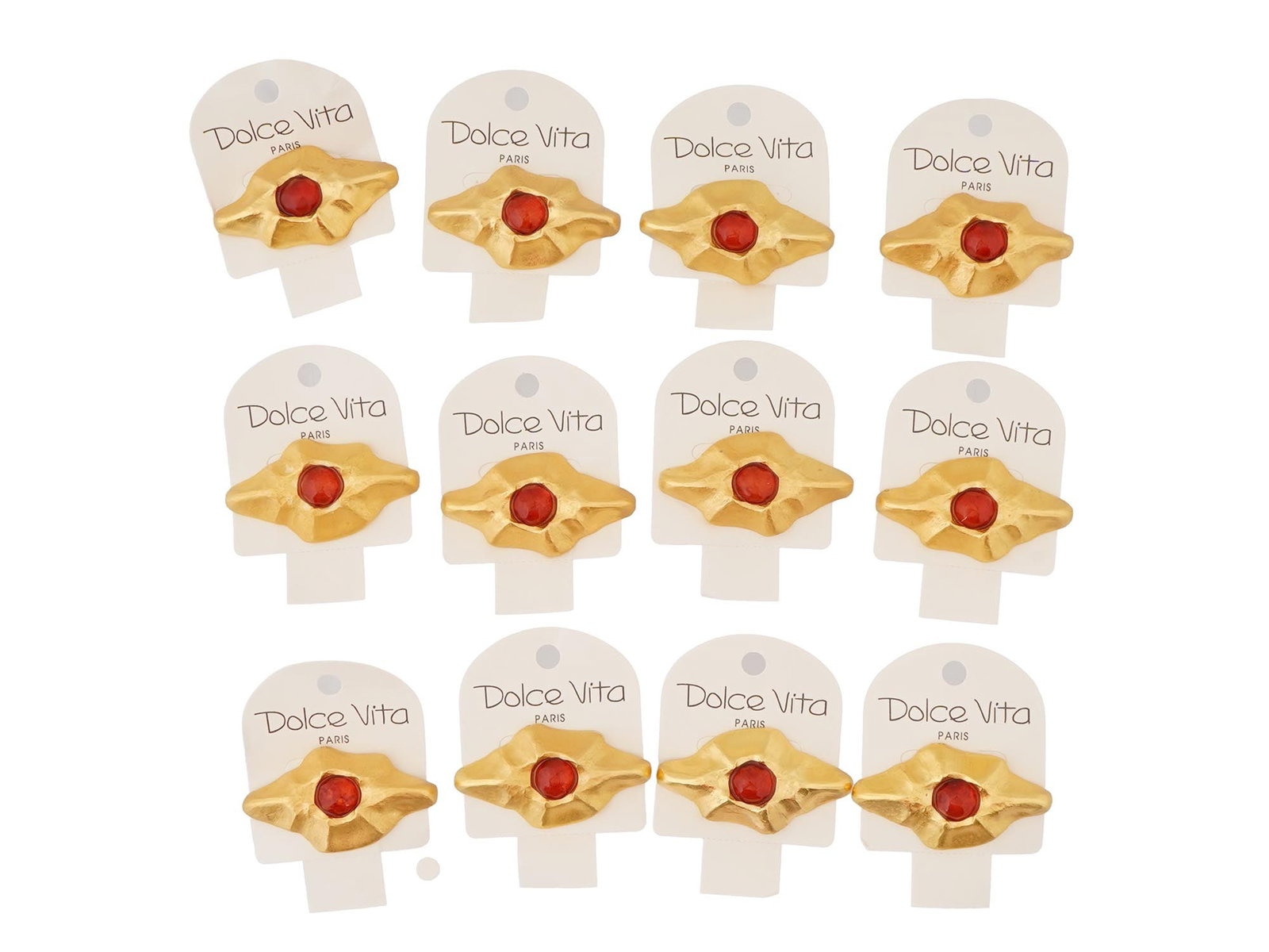 VINTAGE FRENCH DOLCE VITA COSTUME JEWELRY BROOCHES: A vintage French Dolce Vita costume jewelry set, including 12 brooches. The brooches have a stylized, abstract design with a central red colored stone and a textured gold toned metal surrounding it. D