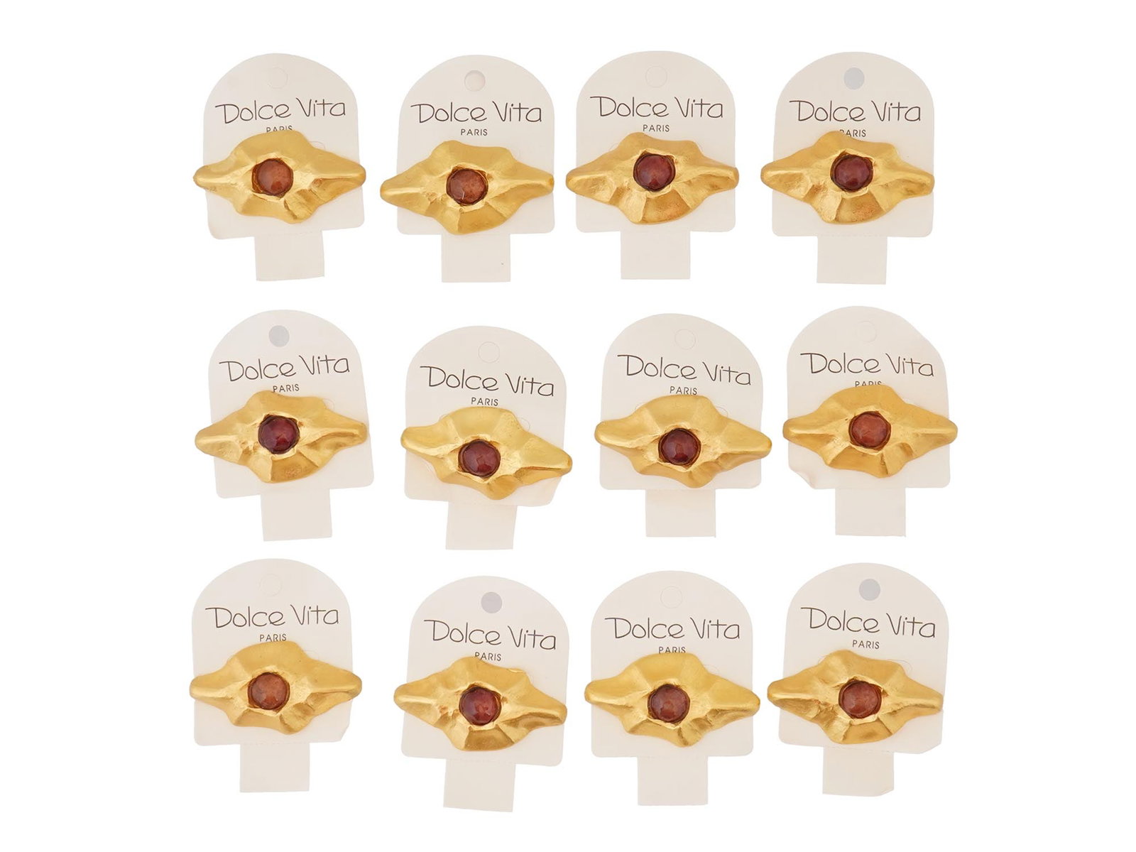 VINTAGE FRENCH DOLCE VITA COSTUME JEWELRY BROOCHES: A vintage French Dolce Vita costume jewelry set, including 12 brooches. The brooches have a stylized, abstract design with a central dark red colored stone and a textured gold toned metal surrounding 