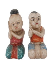 PAIR OF ASIAN HAND CARVED AND PAINTED WOODEN DOLLS