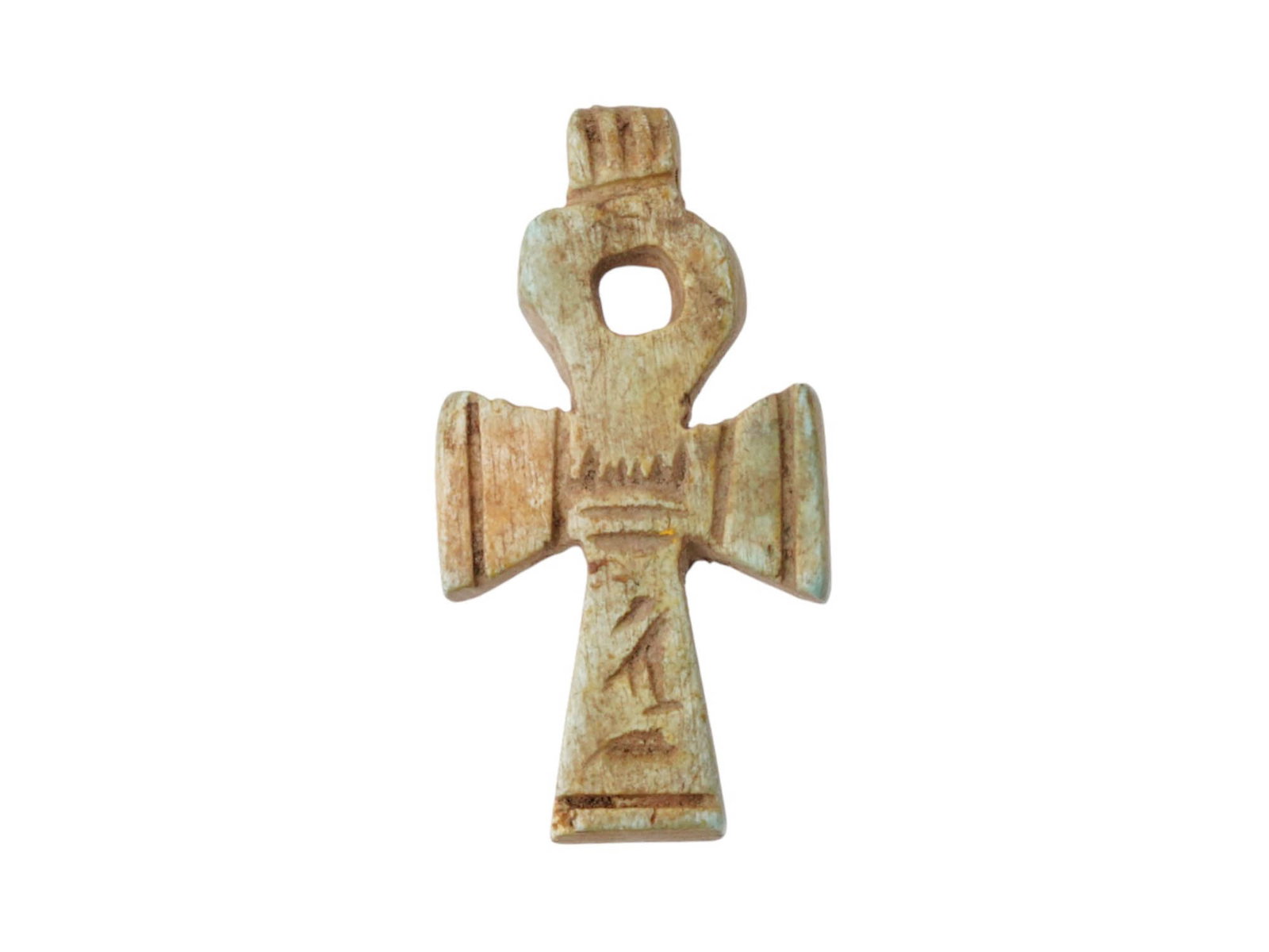 ANCIENT EGYPTIAN 26TH DYNASTY CARVED LIMESTONE ANKH: An ancient Egyptian carved limestone ankh, or key of life, pendant. 26th Dynasty, 663 to 525 B.C. The ankh has a T-shape topped by a droplet-shaped loop. The symbol often appeared in Egyptian art as a