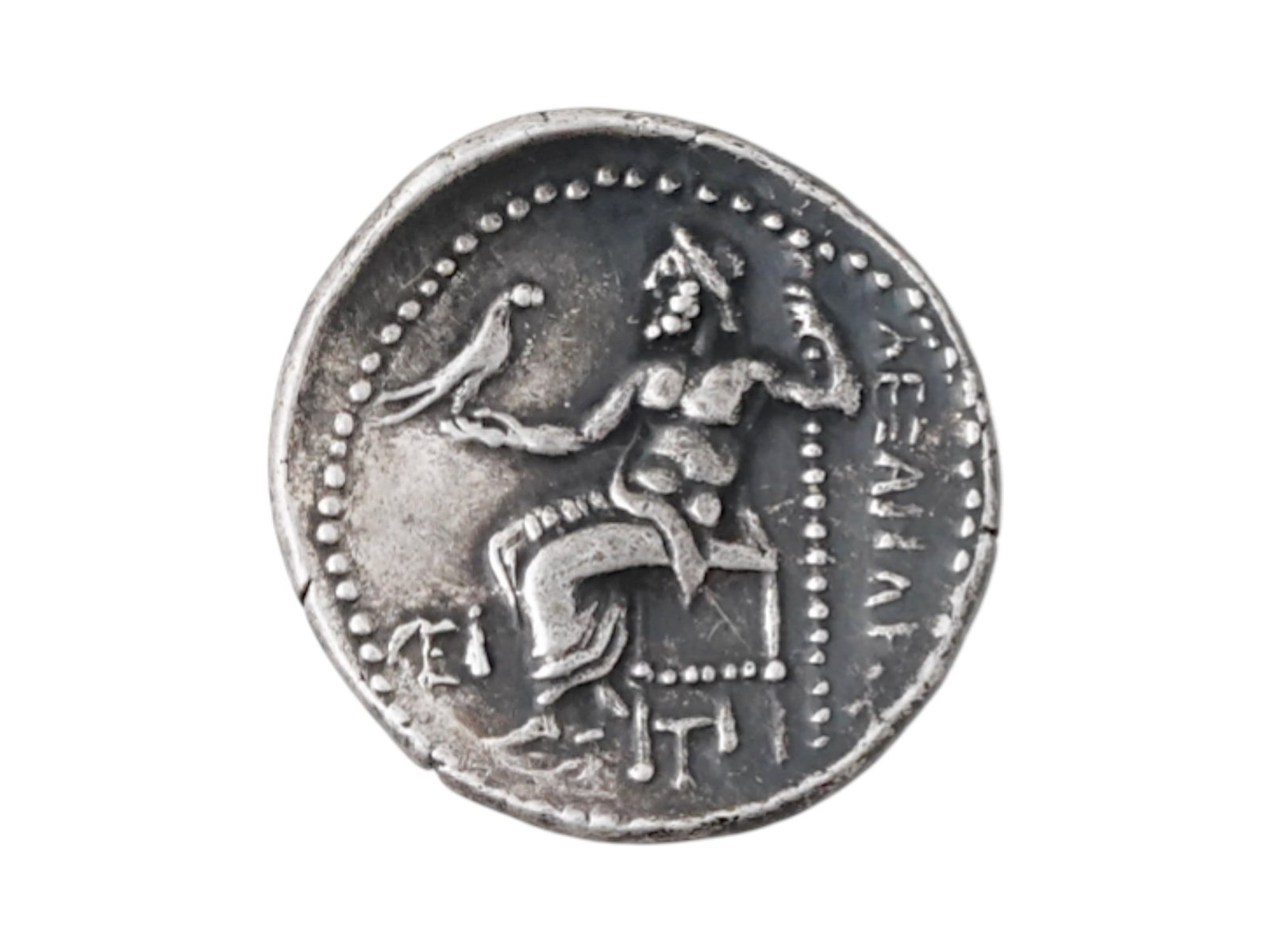 ANCIENT GREEK ALEXANDER THE GREAT SILVER DRACHM COIN: An ancient Greek Alexander the Great silver drachm coin. Circa 315 to 294 BC. The obverse of the coin depicts the profile head of Alexander the Great dressed as Herakles, wearing the Nemean lion skin 