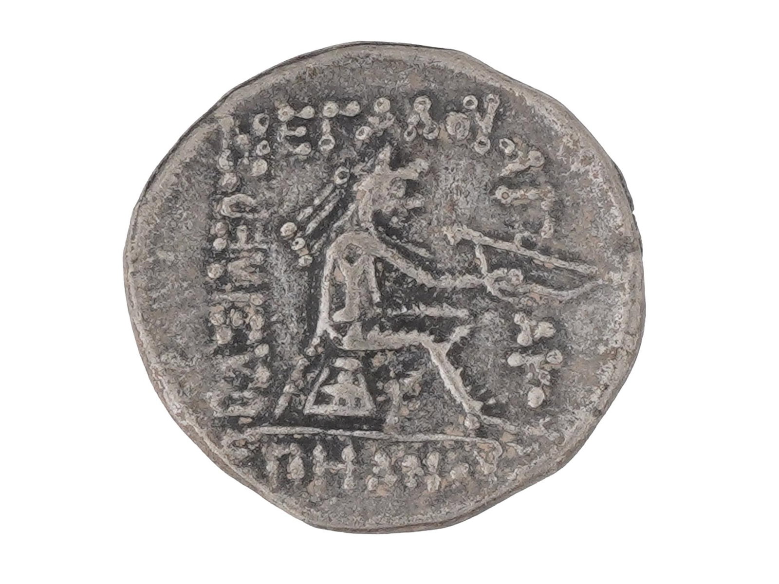 ANCIENT PERSIAN PARTHIAN SILVER MITHRIDATES II COIN: An ancient Persian Parthian empire, 247 BC to 228 AD silver drachm Mithridates II coin. The coin is dated to the period 119 BC - 109 BC. The obverse depicts a bust portrait of Mithridates II to the le