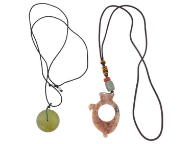 TWO NECKLACES WITH HAND CARVED JADE PENDANTS