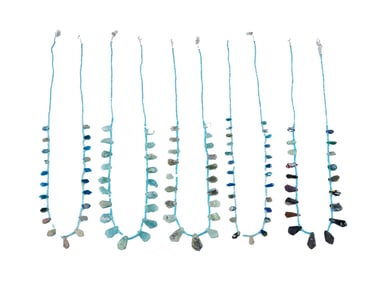 GROUP OF FIVE STRINGS OF BROKEN ROMAN GLASS BEADS