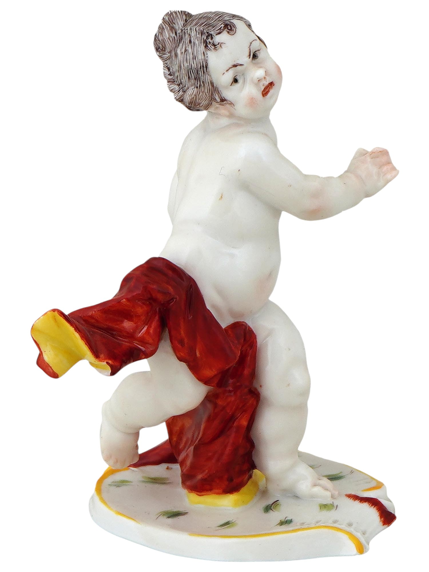ANTIQUE GERMAN NYMPHENBURG PORCELAIN PUTTO FIGURINE: An antique German hand painted porcelain figurine depicting a putto on the base, designed by Franz Anton Bustelli, a renowned German modeller active from 1754 to 1763. Manufactured by the Bavarian Nym