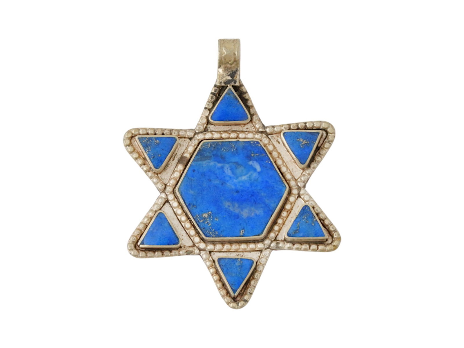 JUDAICA HOLY LAND LAPIS LAZULI SILVER STAR OF DAVID: An antique Judaica Holy Land Star of David inlaid with carved lapis lazuli stone into a silver setting. Circa 19th century. The Magen David is decorated with a dotted pattern along the contour and has