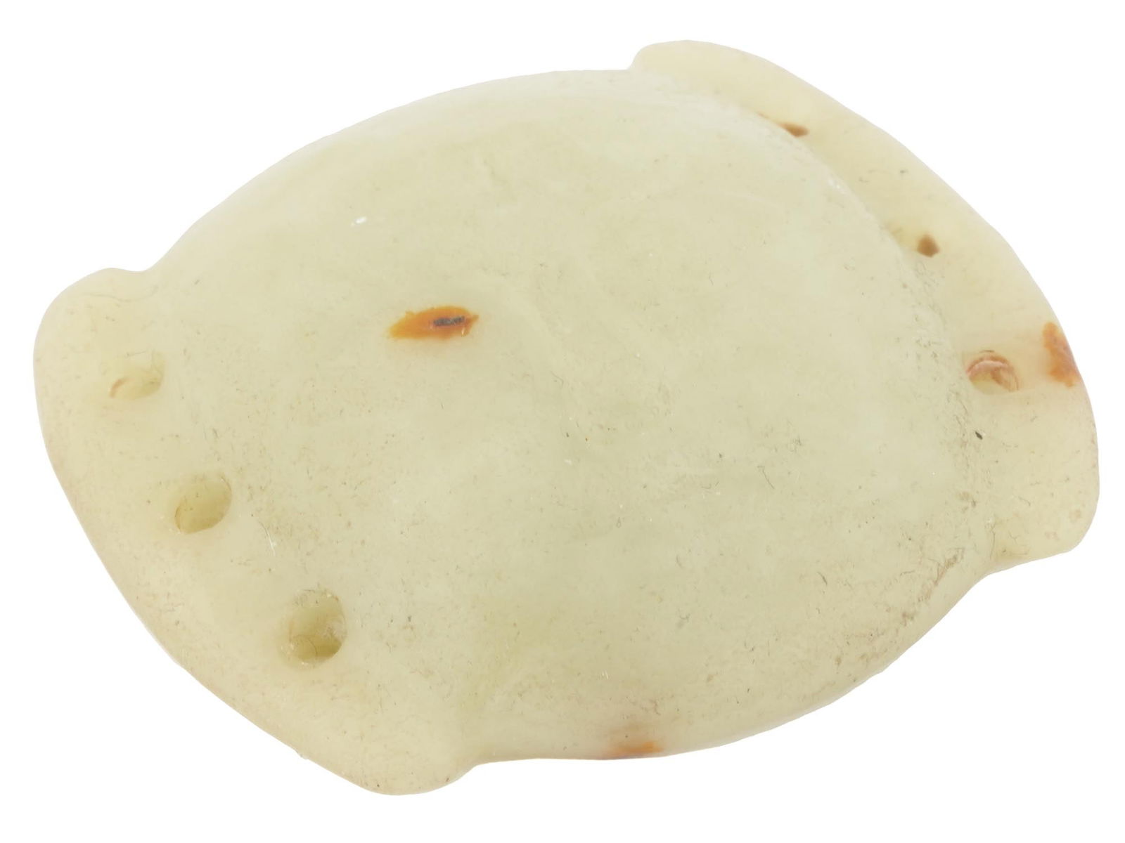 CHINESE HAND CARVED JADE MASK MOTIF BELT BUCKLE: A Chinese hand carved Jade belt buckle. The belt buckle is decorated with an engraved mask motif and holes to the sides. Circa: the first half of the 20th century. Antique and Vintage Asian and Orient