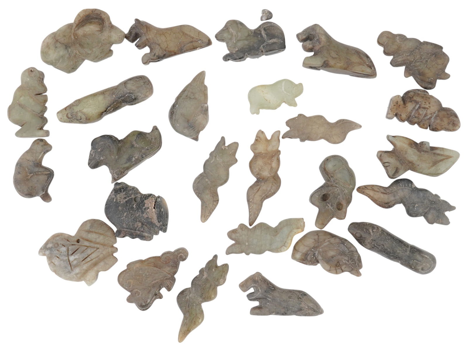 ANTIQUE CHINESE CARVED JADE FIGURINES ZODIAC CALENDAR: A collection of antique Chinese figurines representing the animals of the Chinese zodiac calendar. Each figurine is crafted from jade, showcasing the artistry and attention to detail characteristic of