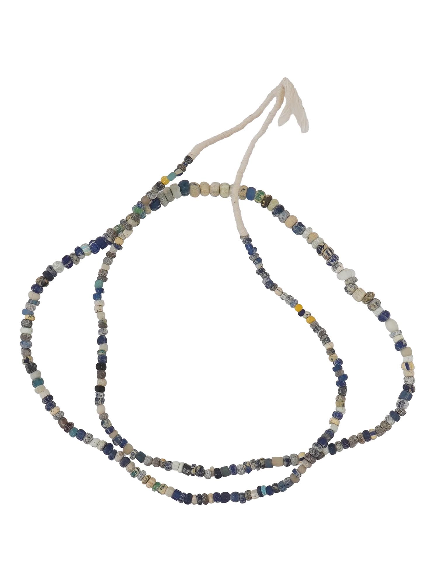 ANCIENT ROMAN GLASS BEAD NECKLACE 100 TO 300 AD: An ancient Roman glass bead necklace dating from 100 to 300 AD. Features a variety of colored glass beads, each uniquely shaped, exemplifying the craftsmanship and artistry of Roman glassmakers during