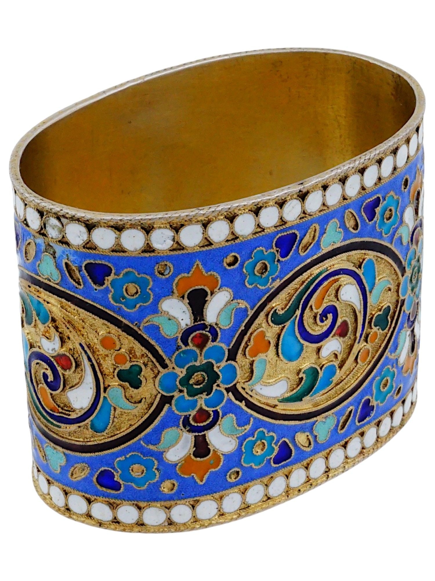 RUSSIAN GILT SILVER CLOISONNE ENAMEL NAPKIN HOLDER: A Russian gilt silver napkin holder with polychrome cloisonne enamel ornaments. Hallmark of 84 silver standard and makers mark by the rim. Collectible Silverware, Tableware And Serveware. THIS