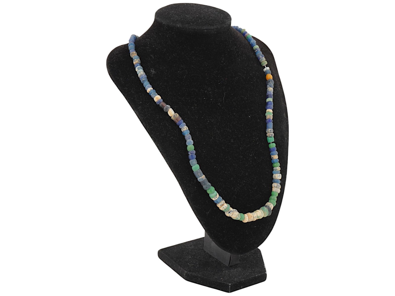 ANCIENT ROMAN MULTICOLOR GLASS BEAD NECKLACE: An ancient Roman glass bead necklace dating from 100 to 300 AD. Features a variety of colored glass beads, each uniquely shaped, exemplifying the craftsmanship and artistry of Roman glassmakers during