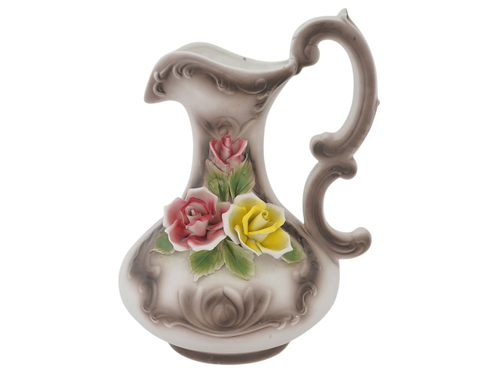 VINTAGE ITALIAN CAPODIMONTE PAINTED CERAMIC PITCHER: A vintage Italian Capodimonte painted ceramic pitcher. The pitcher has a strongly curved shape with a figured handle in the form of a double curl. It is decorated with relief sculptural roses of red a