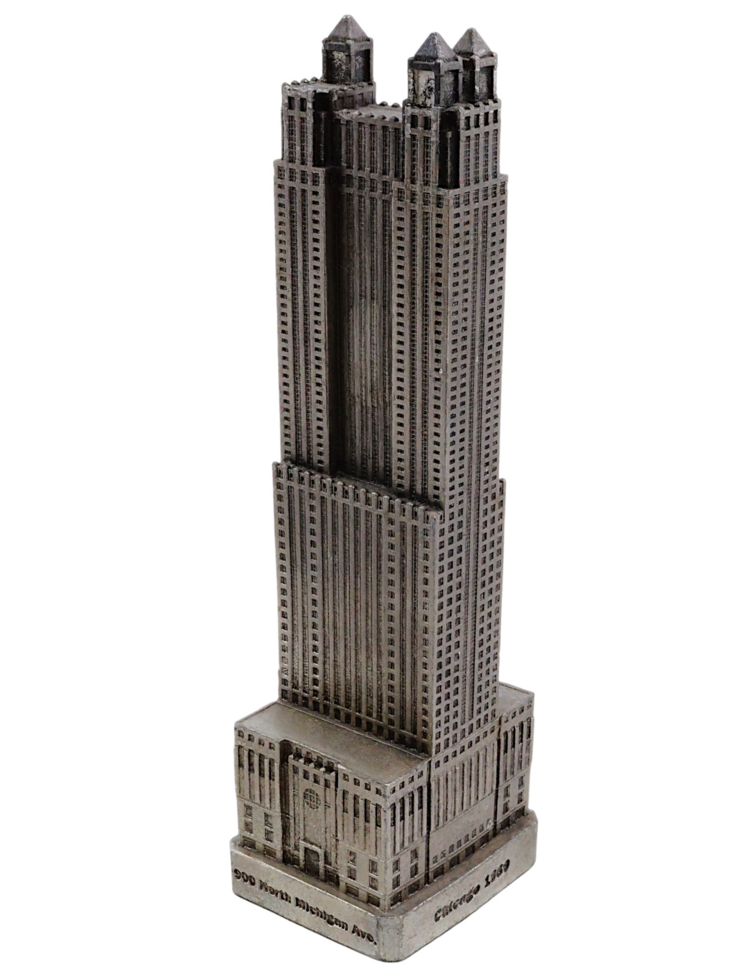 MINI CAST METAL 900 NORTH MICHIGAN BUILDING SCULPTURE: A miniature cast metal sculpture representing a North Michigan Building located at 900 N. Titled on the base. Michigan Street in Chicago, Illinois and was completed in 1989. This building was designed