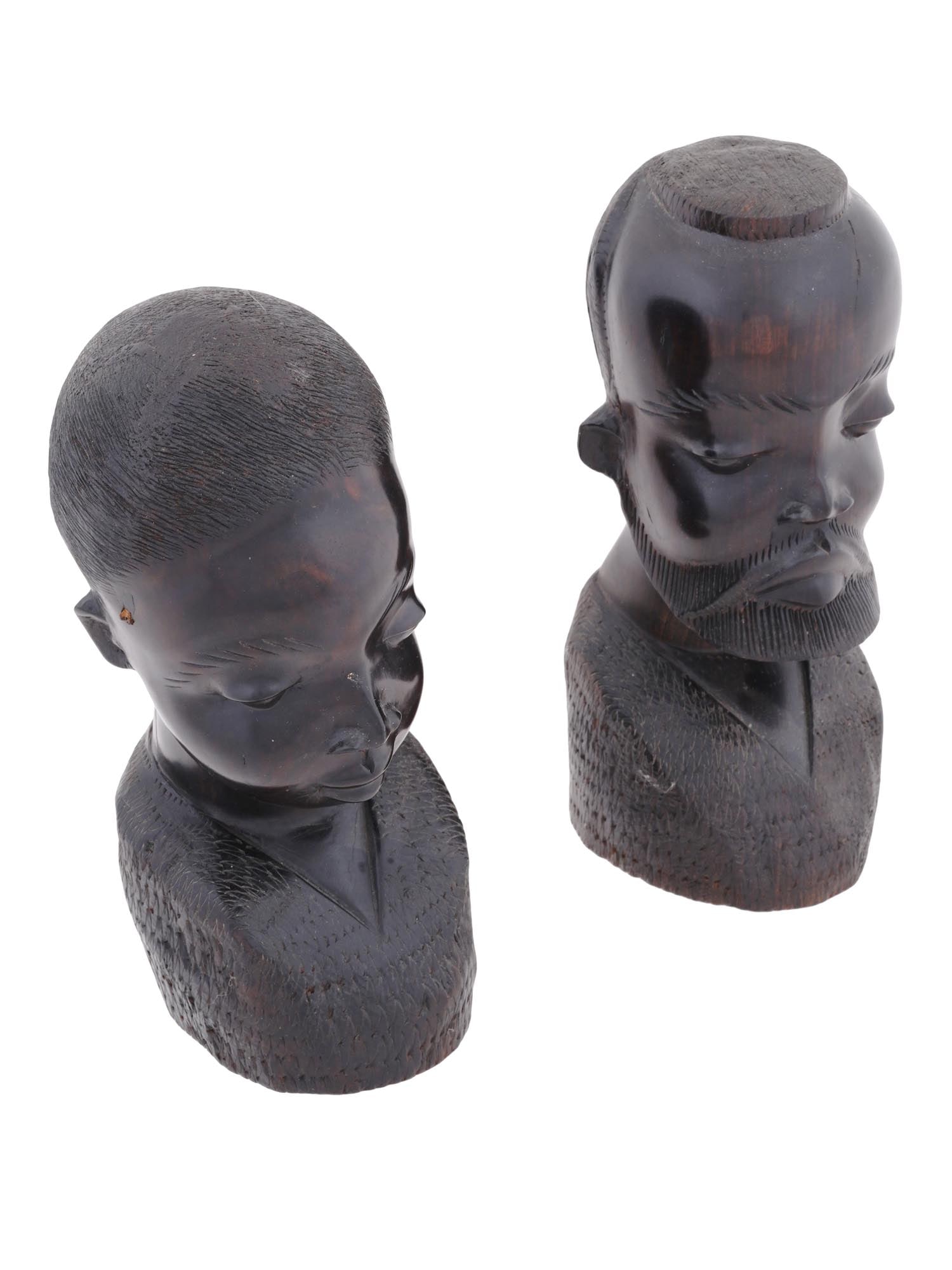 VINTAGE AFRICAN CARVED EBONY MALE AND FEMALE FIGURINES: A vintage African pair of meticulously hand carved figurines. Crafted from rich dark ebony wood, these two figurines, one representing a male and the other a female, are a testament to the artistic tr