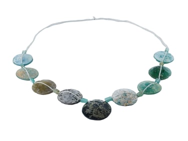 STRING OF ANCIENT ROMAN CIRCULAR GLASS BEADS