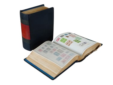 PAIR OF VINTAGE MASTER GLOBAL STAMP ALBUMS WITH STAMPS