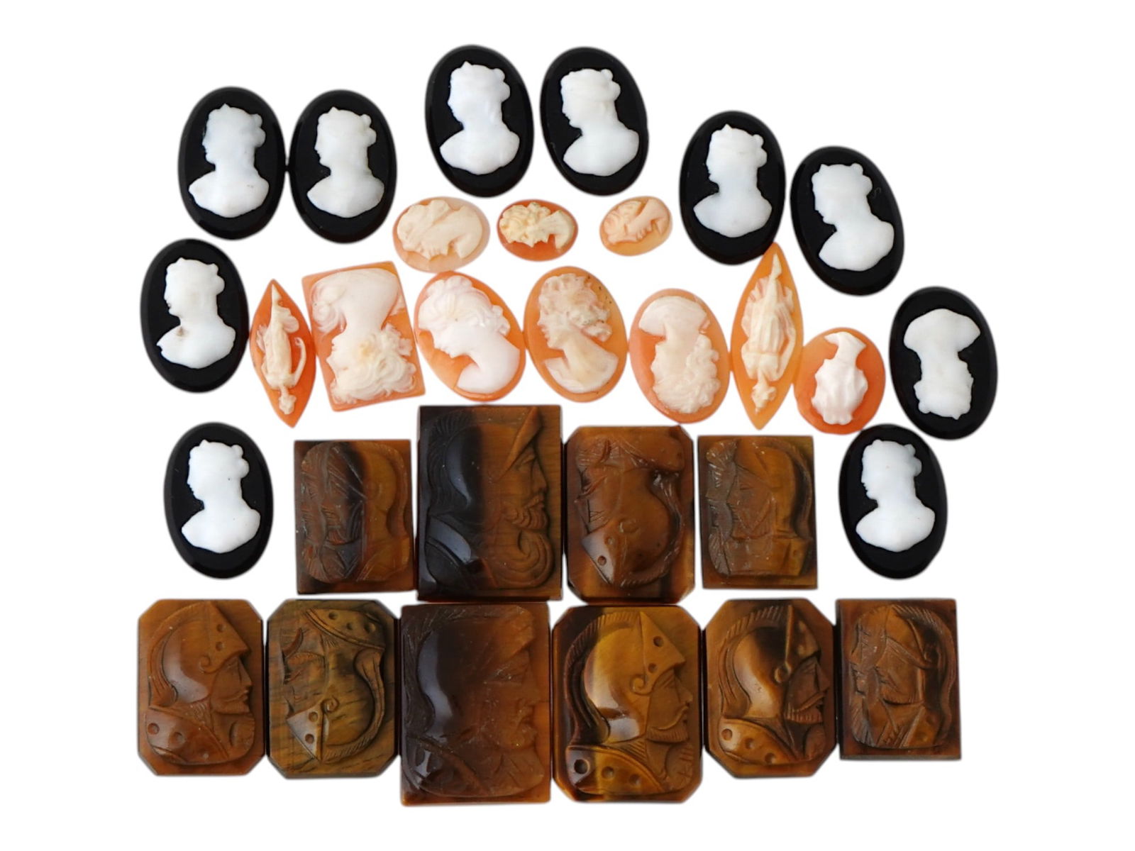 COLLECTION OF ANTIQUE HAND CARVED CAMEOS: A collection of antique hand carved cameos, dating to the late 19th to early 20th century. A total of 30 items. Each piece is crafted from conch shell and stone, featuring knights in armor and female