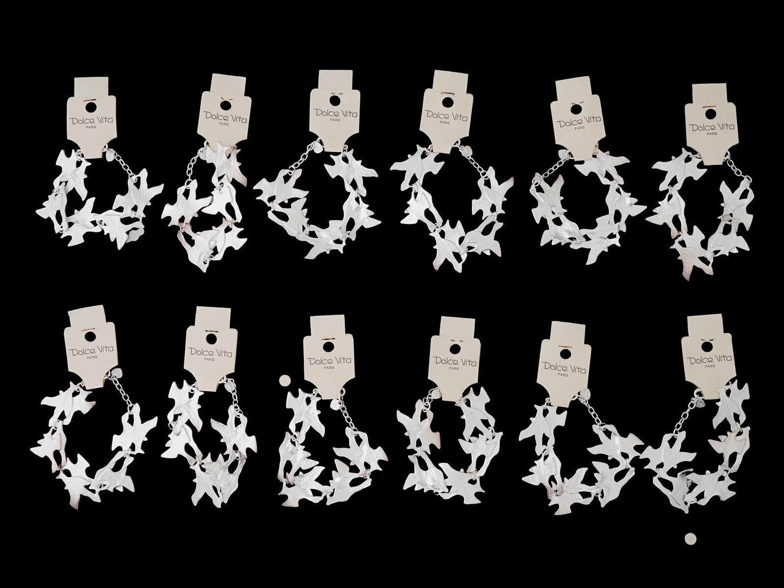 LOT OF FRENCH DOLCE VITA COSTUME JEWELRY BRACELETS: A collection of twelve French Dolce Vita Paris costume jewelry bracelets. Each bracelet is made in a chain link design featuring figural bird links in the Georges Braque manner. Each is marked with an