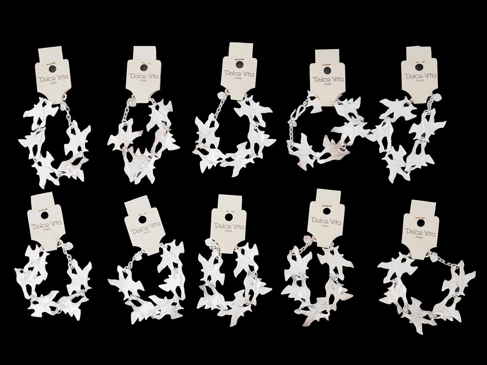 LOT OF FRENCH DOLCE VITA COSTUME JEWELRY BRACELETS: A collection of ten French Dolce Vita Paris costume jewelry bracelets. Each bracelet is made in a chain link design featuring figural bird links in the Georges Braque manner. Each is marked with an im
