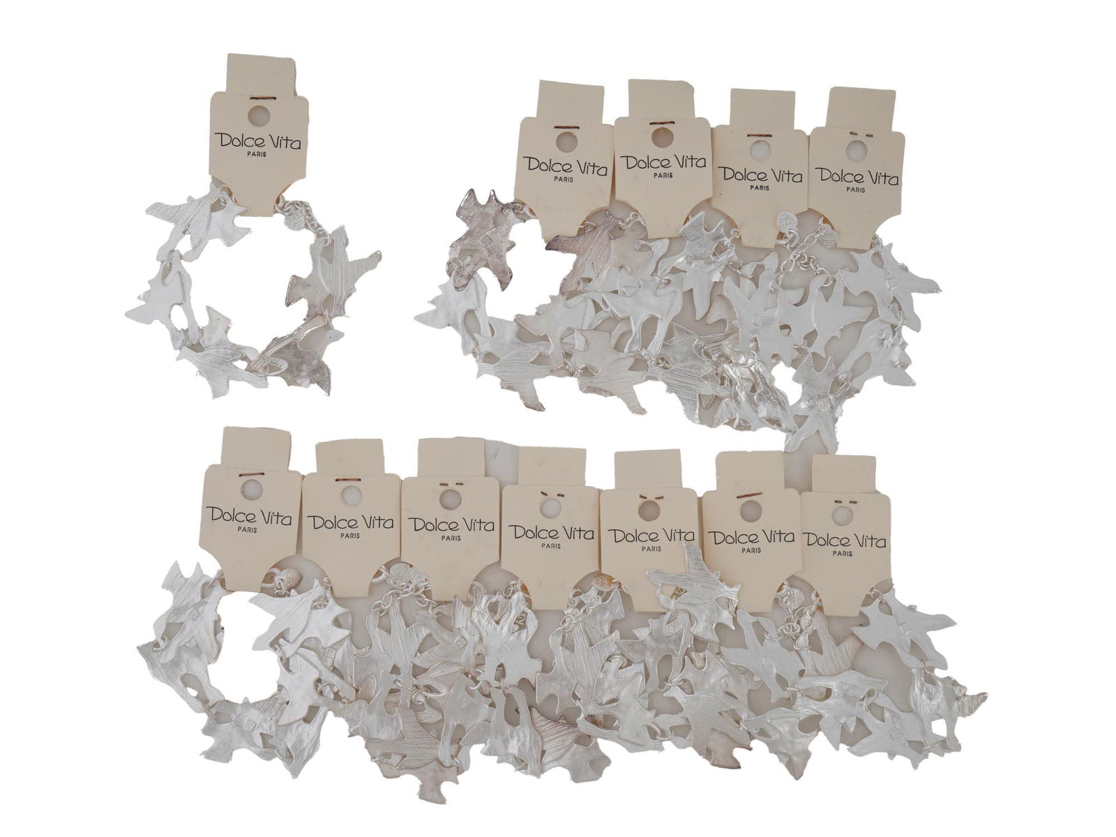 FRENCH DOLCE VITA PARIS COSTUME JEWELRY BRACELETS: A collection of twelve French Dolce Vita Paris costume jewelry bracelets. Each bracelet is made in a chain link design featuring figural bird links in the Georges Braque manner. Each is marked with an