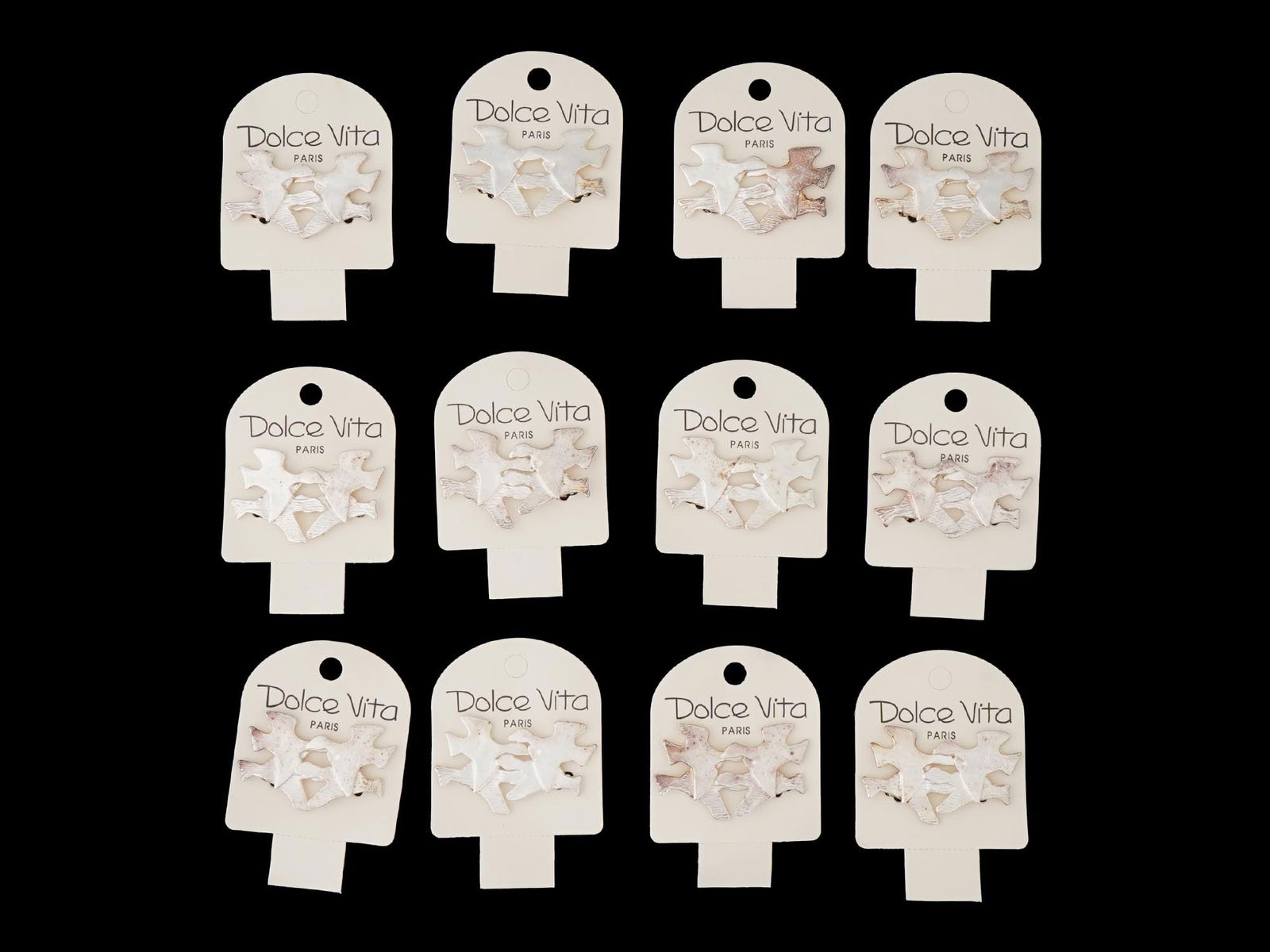 LOT OF FRENCH DOLCE VITA COSTUME JEWELRY EARRINGS: A collection of twelve pairs of French Dolce Vita Paris costume jewelry earrings. Each pair is made in a figural design representing a bird in the Georges Braque manner. Each is marked with an impress
