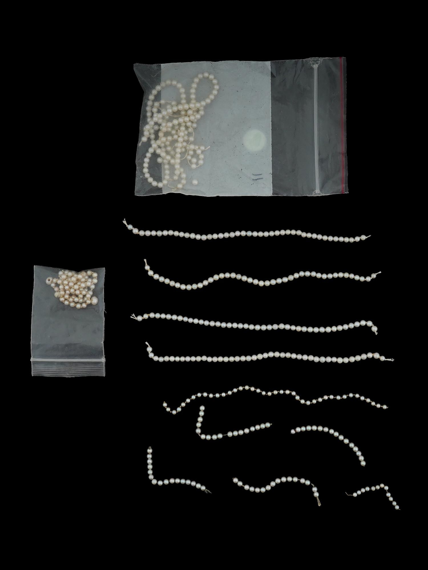 COLLECTION OF MOTHER OF PEARL BEADS F JEWELRY DESIGNS: A collection of mother of pearl beads featuring an assortment of two tone pieces, showcasing the natural iridescence and luster that make them a timeless favorite. Some beads are already strung on tem