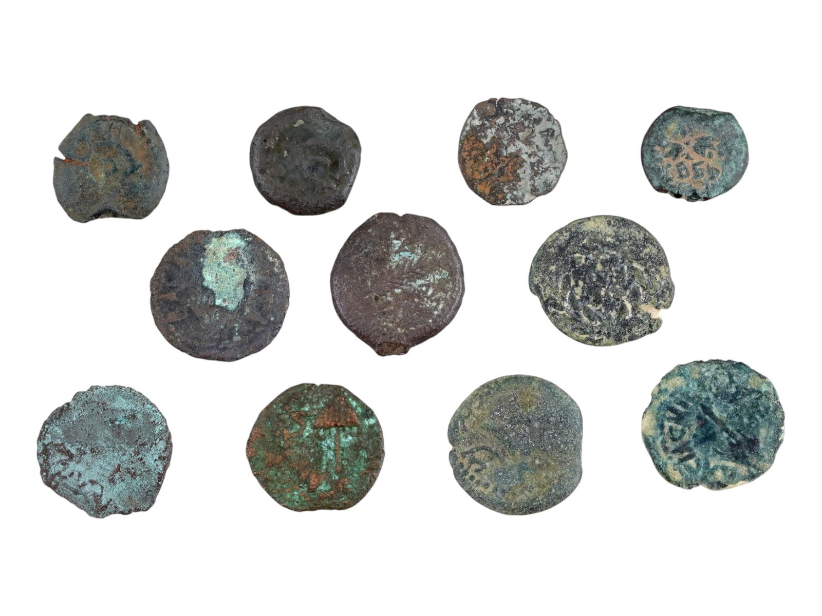 GROUP OF 11 ANCIENT HOLY LAND JUDAICA BRONZE COINS: A group of 11 ancient Holy Land, Judaica bronze coins, each features an engraved image, circa 100 AD. Historical Collectibles, Numismatics, Coins And Medals. THIS LOT IS ELIGIBLE FOR A 30-DAY