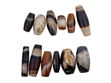 COLLECTION OF ANCIENT CARVED AGATE STONE BEADS