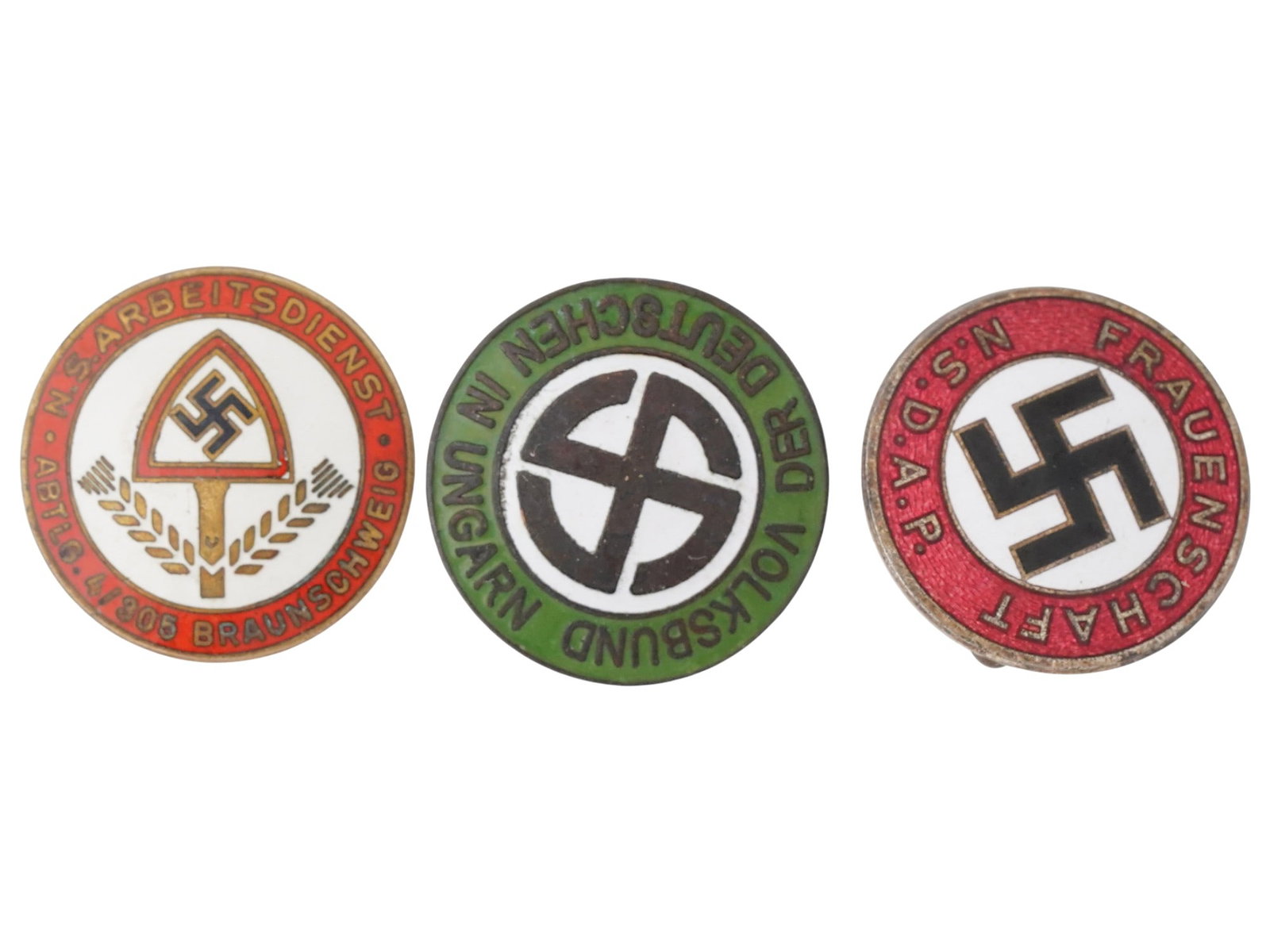 WWII NAZI GERMAN SWASTIKA PIN BADGES: A lot of three pins with Nazi party emblems. Reich Labour Service, NS Arbeitsdienst Abstlg. 4-305 Braunschweig. Volksbund der Deutschen in Ungarn, German Union in Hungary. NSDAP Frauenschaft. The piec
