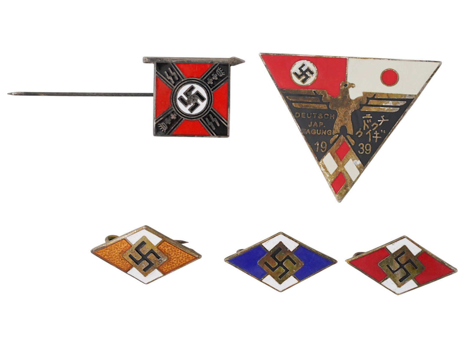 WWII GERMAN THIRD REICH BADGES DANZIG WAFFEN FLAG PIN: A group of WWII Nazi German badges, including a 1939 German Japanese Alliance pin badge, a Danzig Waffen SS Totenkopf flag pin, and three Hitler Youth pin badges in various colors. Second World War Na