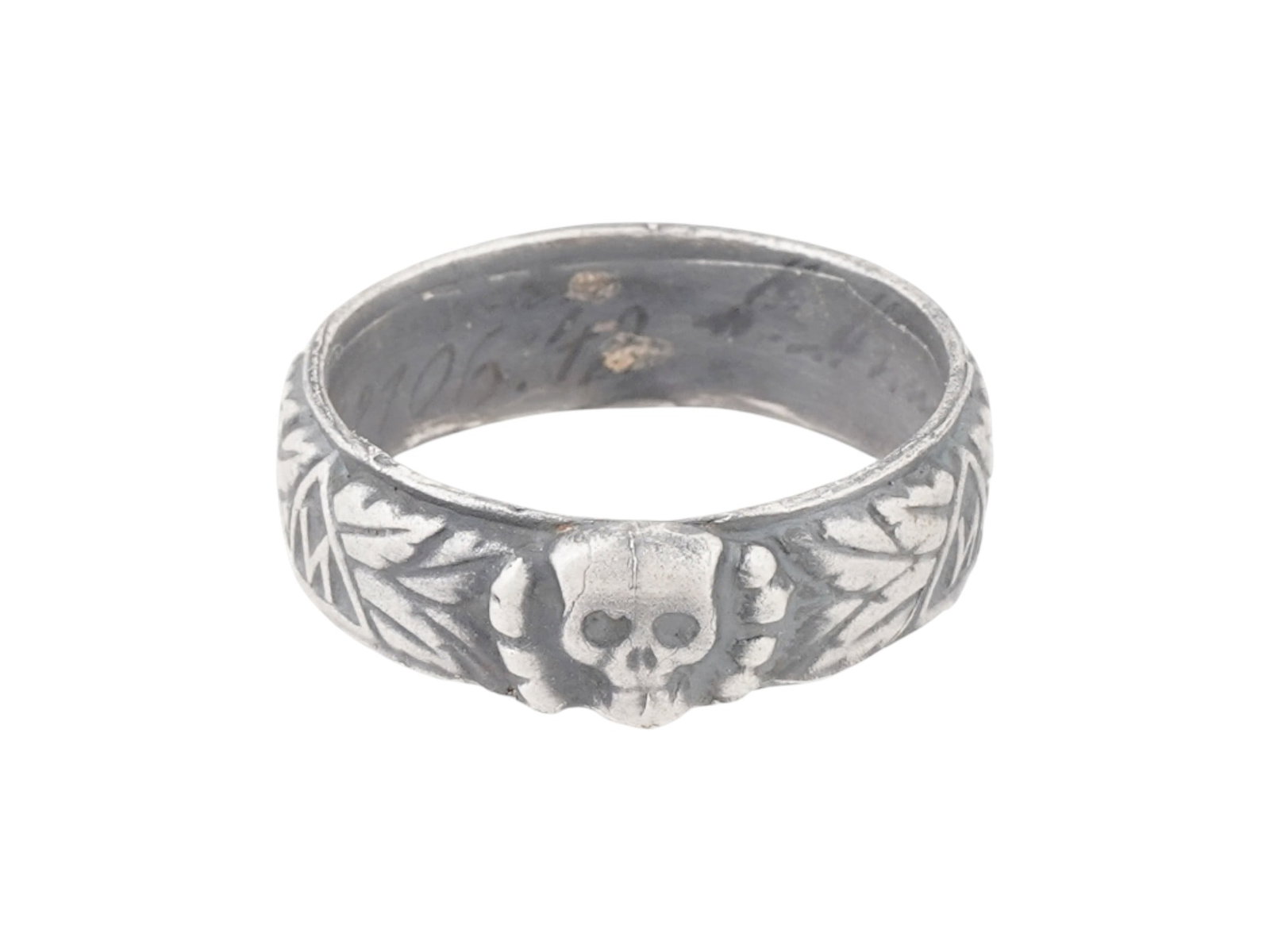 WWII MODEL NAZI GERMAN SS HONOR SILVER RING: A WWII model Nazi German Third Reich SS Himmler Honor, likely silver, ring. The exterior of the ring is engraved with oak leaves and swastika insignia patterns, and a Totenkopf insignia in the center.