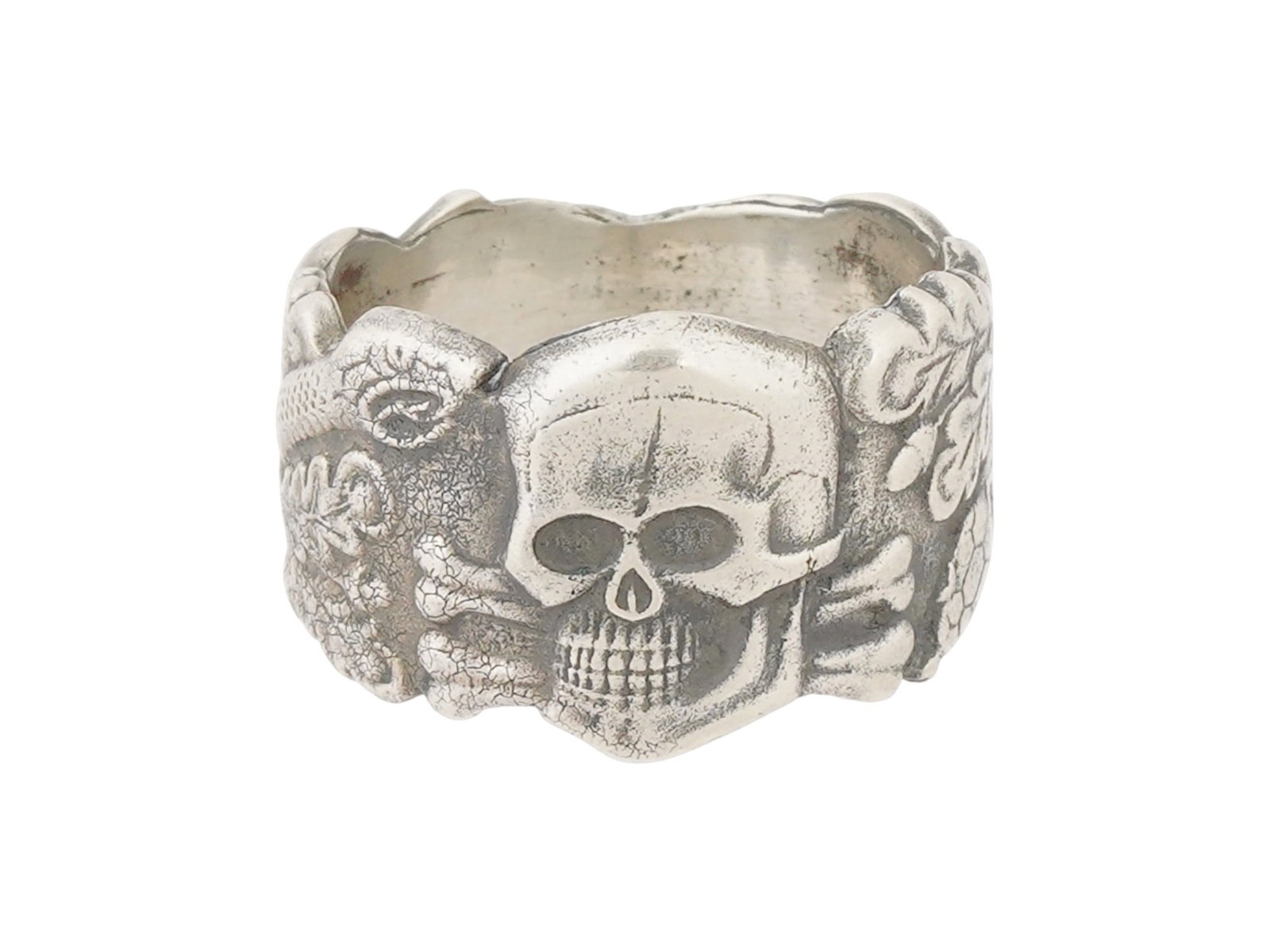 GERMAN WWII TYPE WAFFEN SS ANTI PARTISAN SILVER RING: A WWII Nazi German Third Reich type Waffen SS Anti Partisan Warfare Totenkopf Silver ring. The exterior of the ring features an engraved image of a Totenkopf skull in the center and a snake with oak l