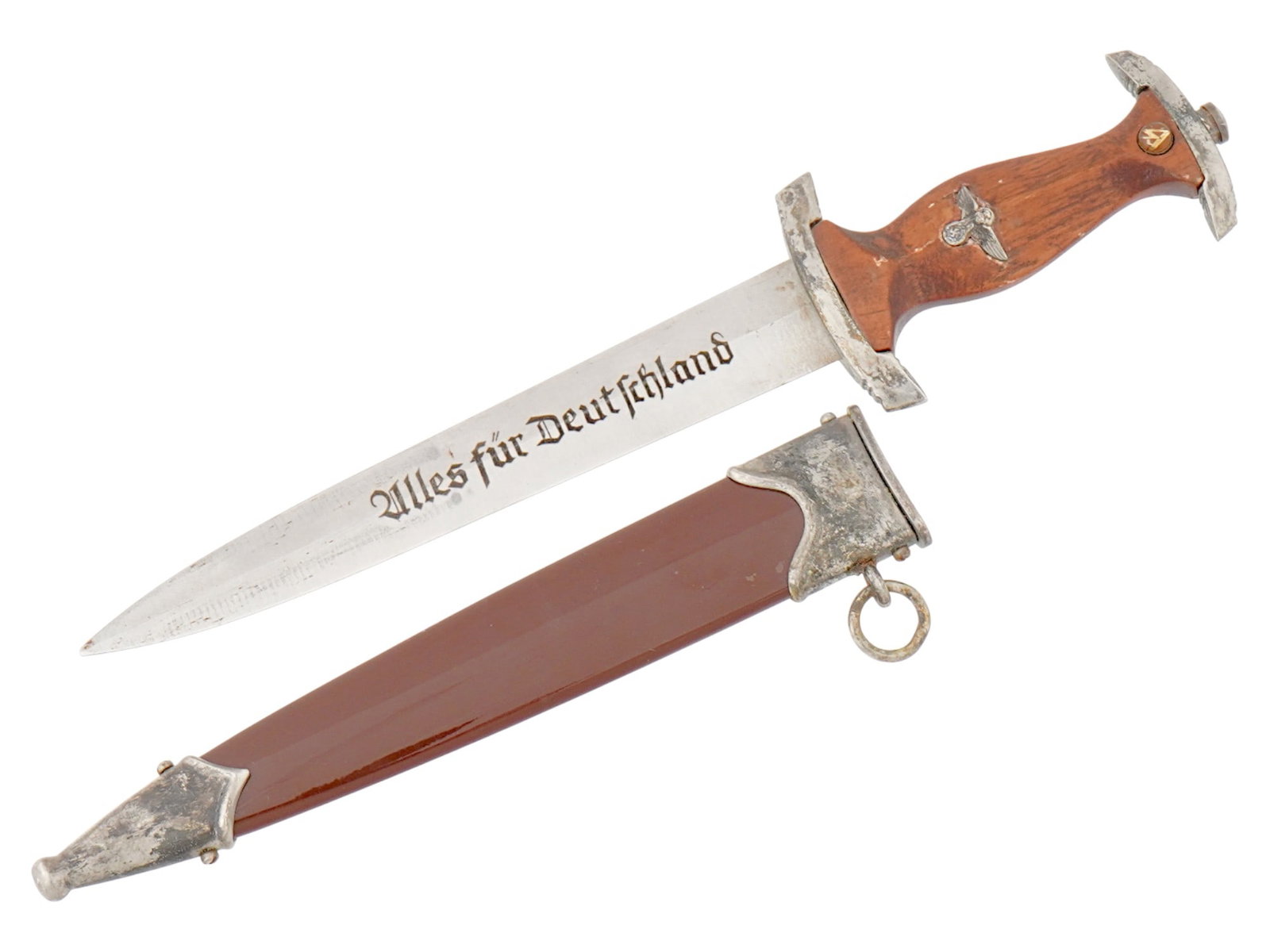 NAZI GERMAN WWII THIRD REICH SA DAGGER W SCABBARD: A WWII Nazi German Third Reich SA dagger. The double edged steel blade of the dagger is engraved with the motto in German, Alles Fur Deutschland, Everything for Germany. The dagger features a fruitwoo