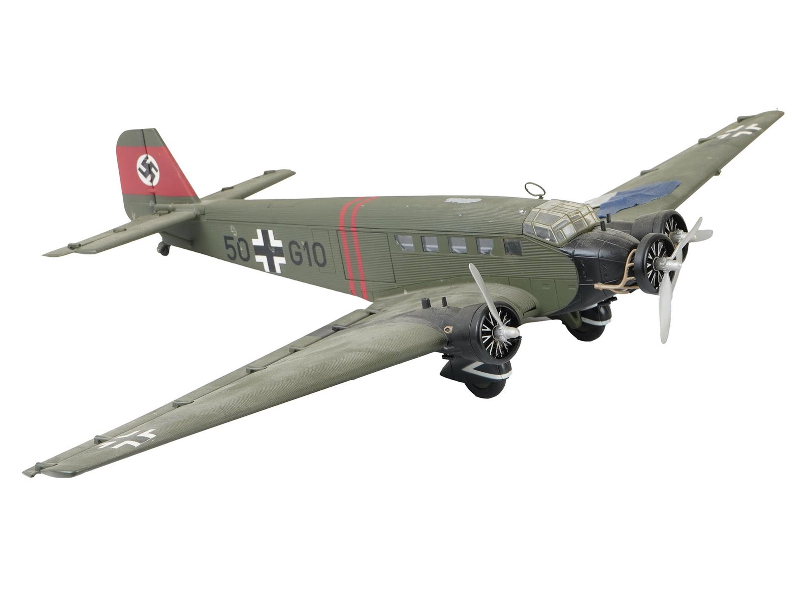 VINTAGE GERMAN TRANSPORT JUNKERS JU 52 PLANE MODEL: A vintage German transport aircraft Junkers Ju 52 plane model. Marked Ju52 EMPM under one wing. Labeled Crafted in China. The Junkers Ju 52, nicknamed Tante Ju, Aunt Ju, and Iron Annie, is a transport
