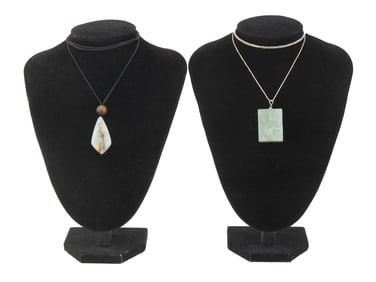 TWO VINTAGE SILVER NECKLACES WITH CARVED JADE PENDANTS
