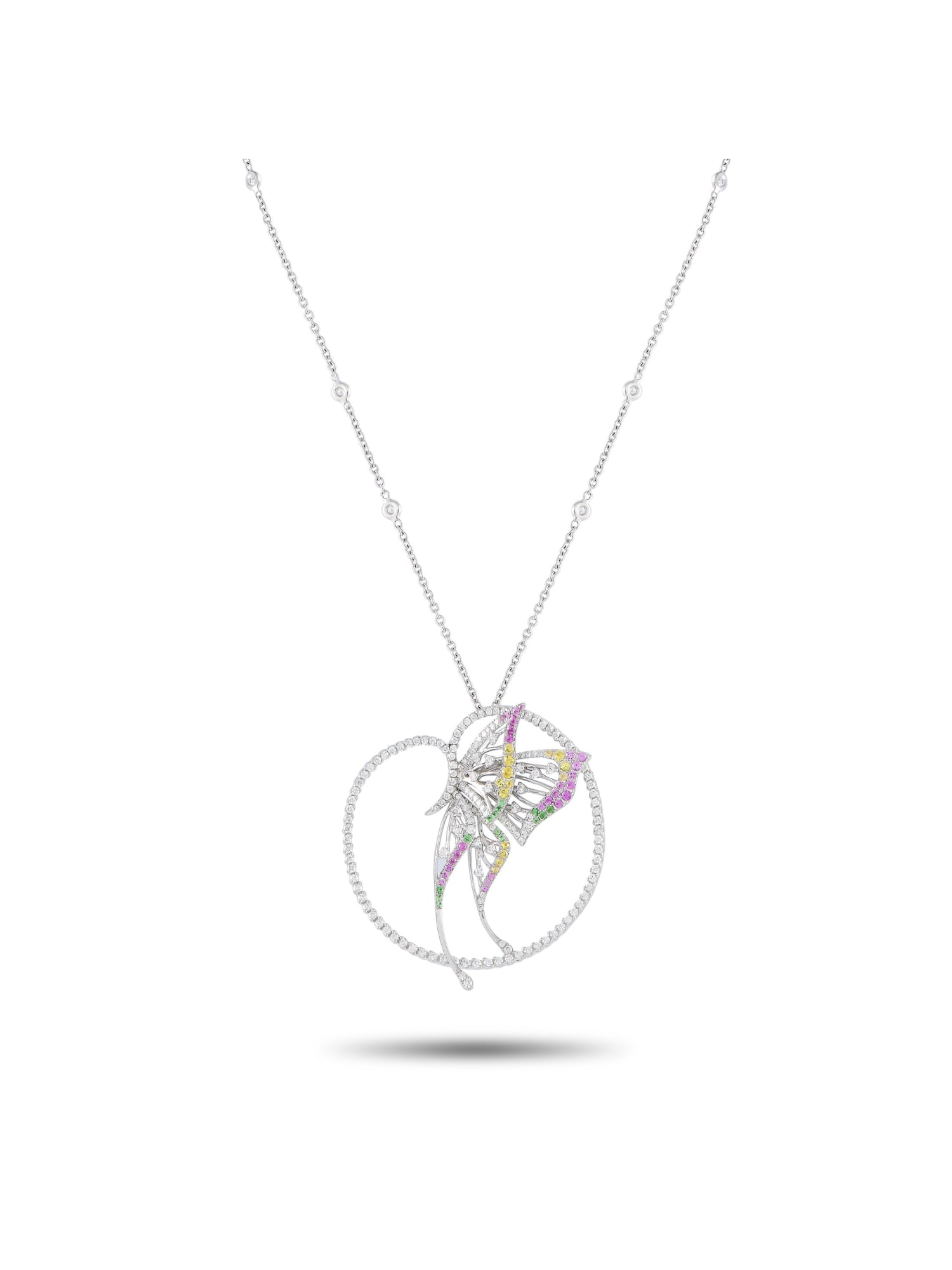 BUCHERER 18K GOLD DIAMOND SAPPHIRE AND TSAVORITE NECKLACE: Trust us, this Bucherer necklace can elevate your style to new heights. Rendered in white gold, this beautiful piece carries a slim chain with a captivating butterfly pendant. The delicate-looking pap