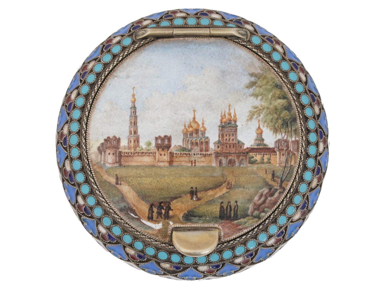 RUSSIAN HAND PAINTED SILVER AND ENAMEL TRINKET BOX: A Russian 88 silver round pill box with a polychrome enamel decoration. The box has a hinged lid that is covered with a hand-painted landscape, a panoramic view of the Novodevichy Monastery in Moscow.