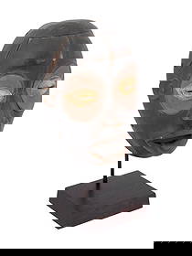 CENTRAL AFRICAN BAULE PEOPLE CARVED WOODEN MASK: A Central African Ivory Coast hand carved wooden male mask of Baule people. The mask is modeled with narrow eyes, an open mouth, and small ears. The lower and upper eyelids around the eyes are painted