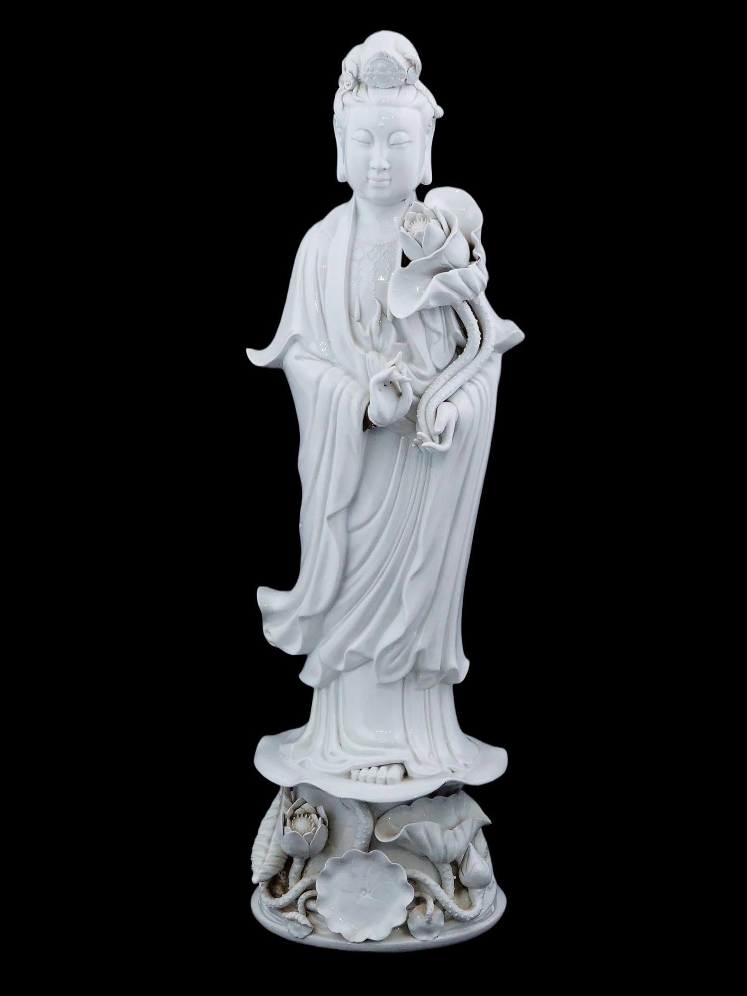 CHINESE BLANC DE CHINE GUANYIN PORCELAIN SCULPTURE: A Chinese Blanc de Chine white glazed porcelain sculpture. The artwork represents Guanyin, a character of Chinese, Vietnamese, Korean, and Japanese mythology, a bodhisattva or a deity who appears main