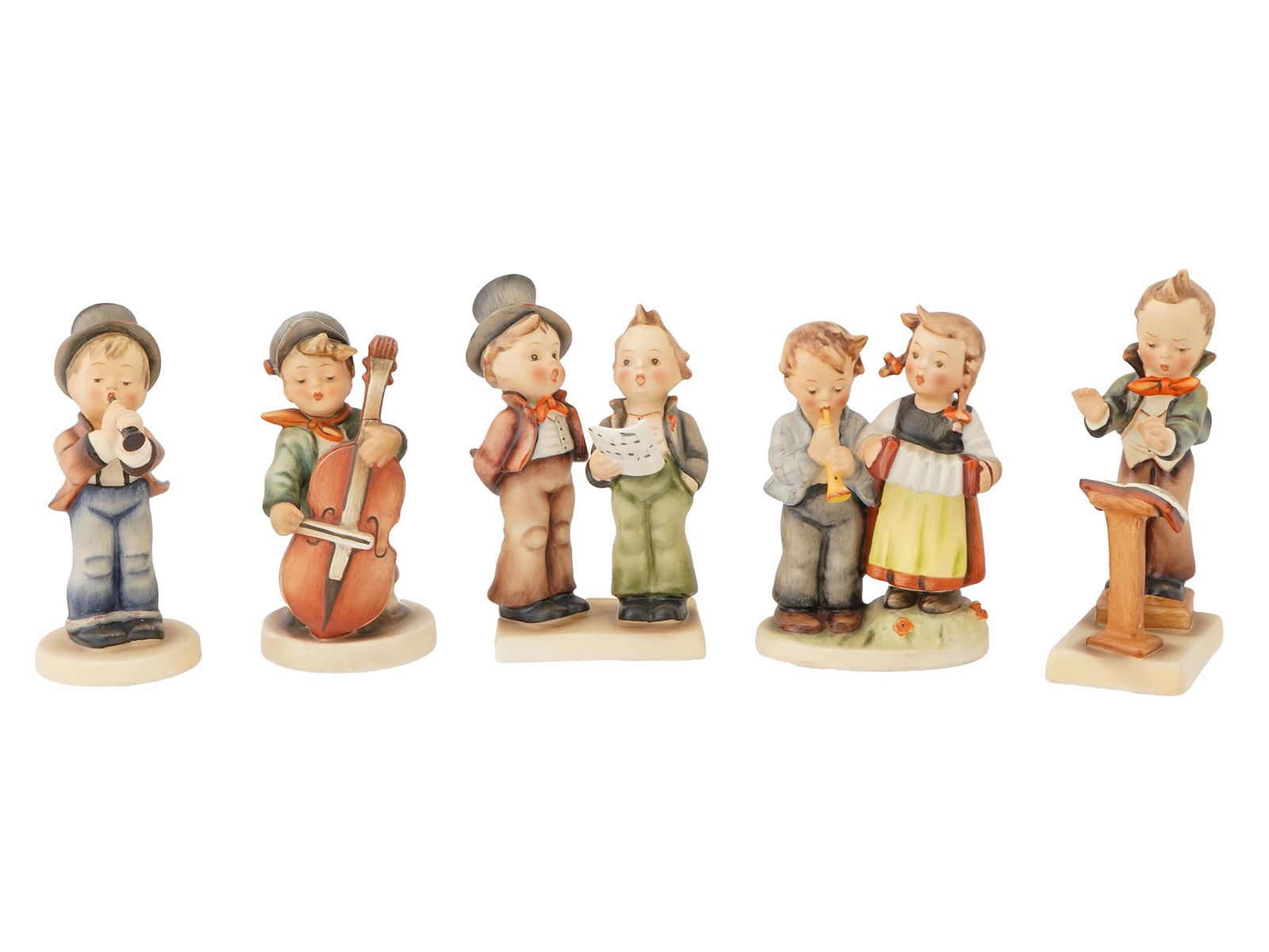 MID CENT GOEBEL HUMMEL PORCELAIN FIGURES MUSICIANS: A lot of West German handpainted porcelain Hummel figurines by Goebel. Dated from late 1940s to 1990s. A total of 5 items representing children singing or playing musical instruments. Each piece has a