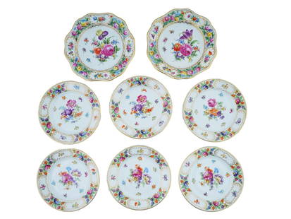 GROUP OF DRESDEN THIEME SCHUMANN PORCELAIN PLATES: The lot includes two reticulated porcelain plates by Carl Thieme, circa 1902-1911, painted with beautiful floral arrangements to the center, and cartouche borders are hand painted with elegant floral