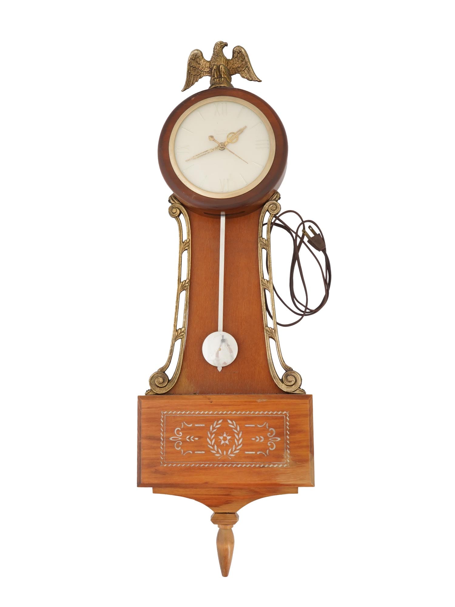 UNITED CLOCK CORP WOODEN BANJO WALL CLOCK: An electrical wall clock by United Clock Corp., an American manufacture established in Brooklyn, NY in 1905. Model no. 408. Banjo-shaped wooden case with brass decor and eagle finial. Round white dial