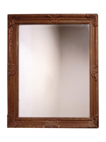 A LARGE ANTIQUE MIRROR WITH A WOODEN FRAME