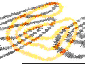 LARGE NATURAL BALTIC AMBER BEADED DESIGN NECKLACE: A large vintage necklace made of carved natural Baltic amber stone beads in abstract shapes. The necklace is made in a beaded design. Vintage and Mid century Carved Natural Stone Necklaces, Jewelry Wa