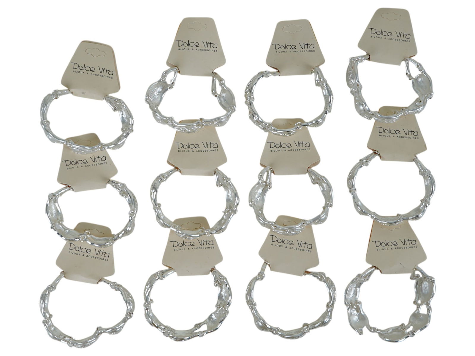 LOT OF FRENCH DOLCE VITA LINK BRACELETS: A lot of vintage French Dolce Vita costume jewelry, a total of 12 silver-tone link bracelets. Ca. 1980s. Original labels are preserved. The links are shaped as tree leaves. Dolce Vita was a jewelry at