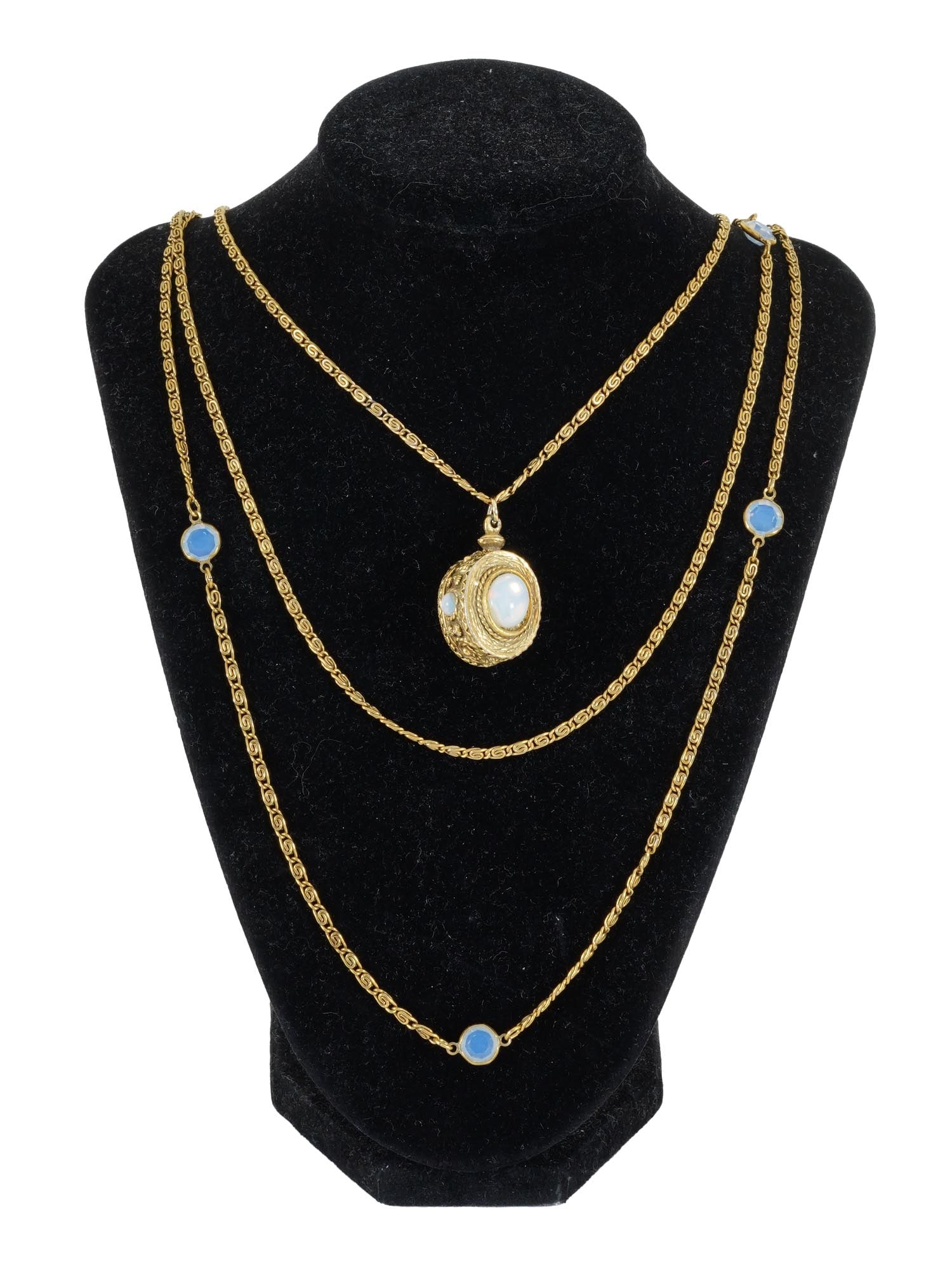 GOLDETTE THREE STRAND GOLD TONE NECKLACE W PENDANT: A vintage Goldette three strand gold tone necklace. The necklace is made in a chain design in the Victorian manner. The ware is adorned with a pendant encrusted with a faux moonstone. Marked with copy